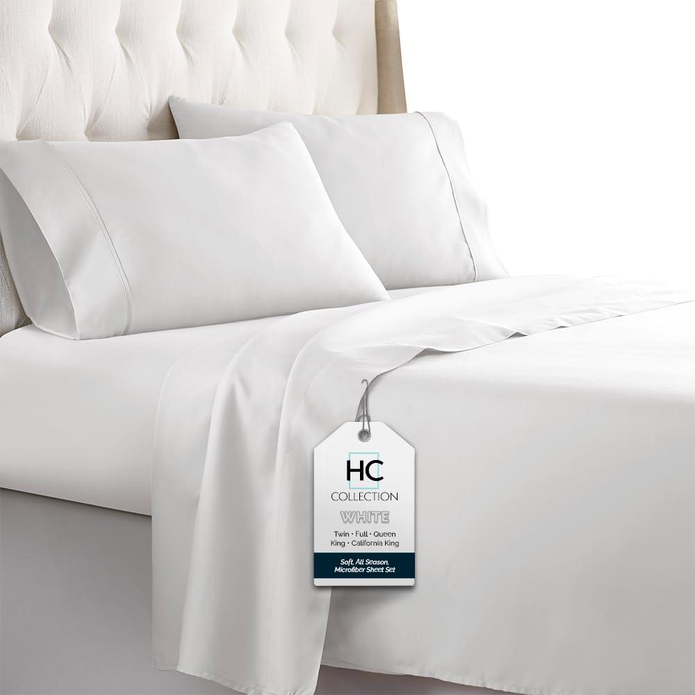 HC COLLECTION Full Sheet Set in White, folded on a bed