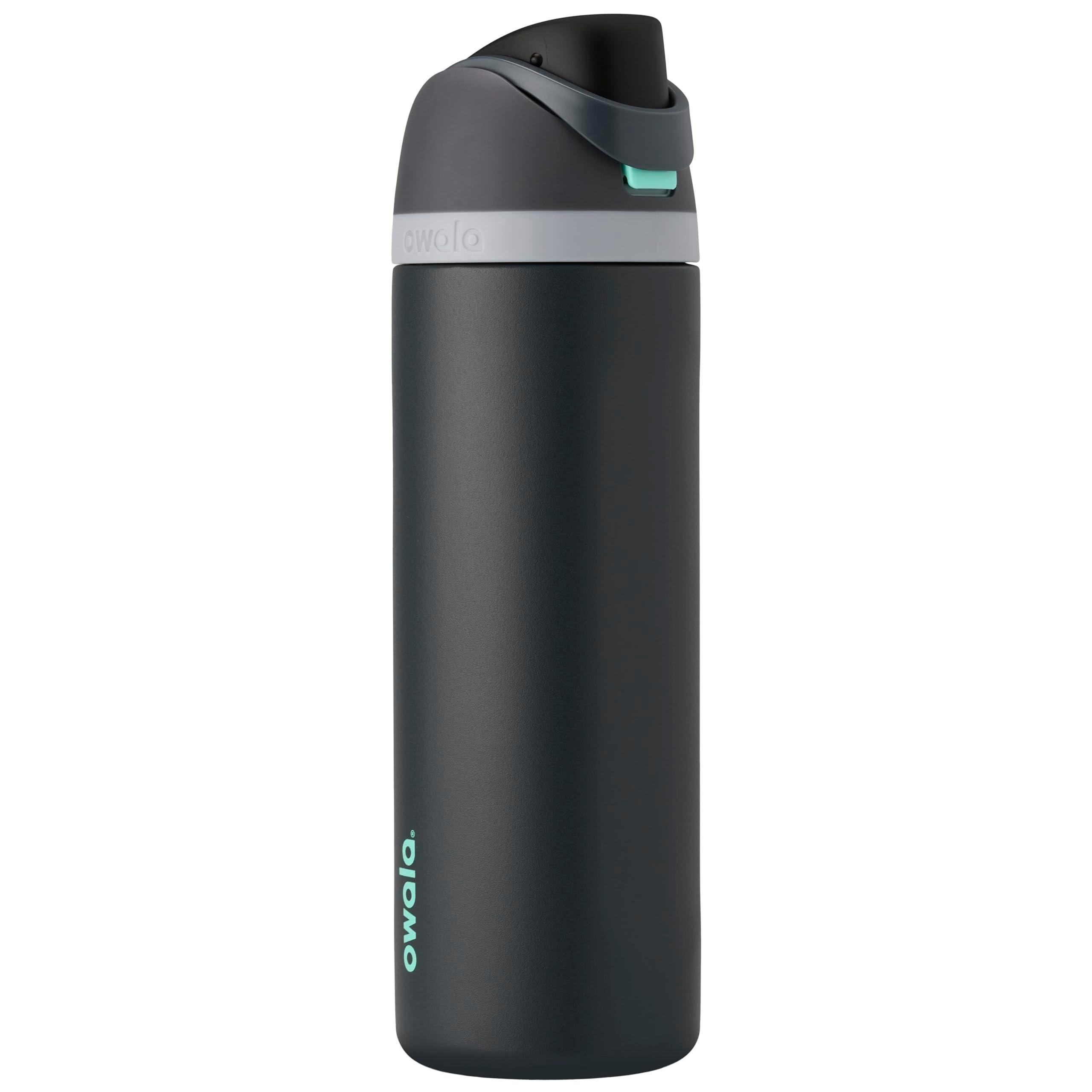 Insulated water bottle on a sunny outdoor table