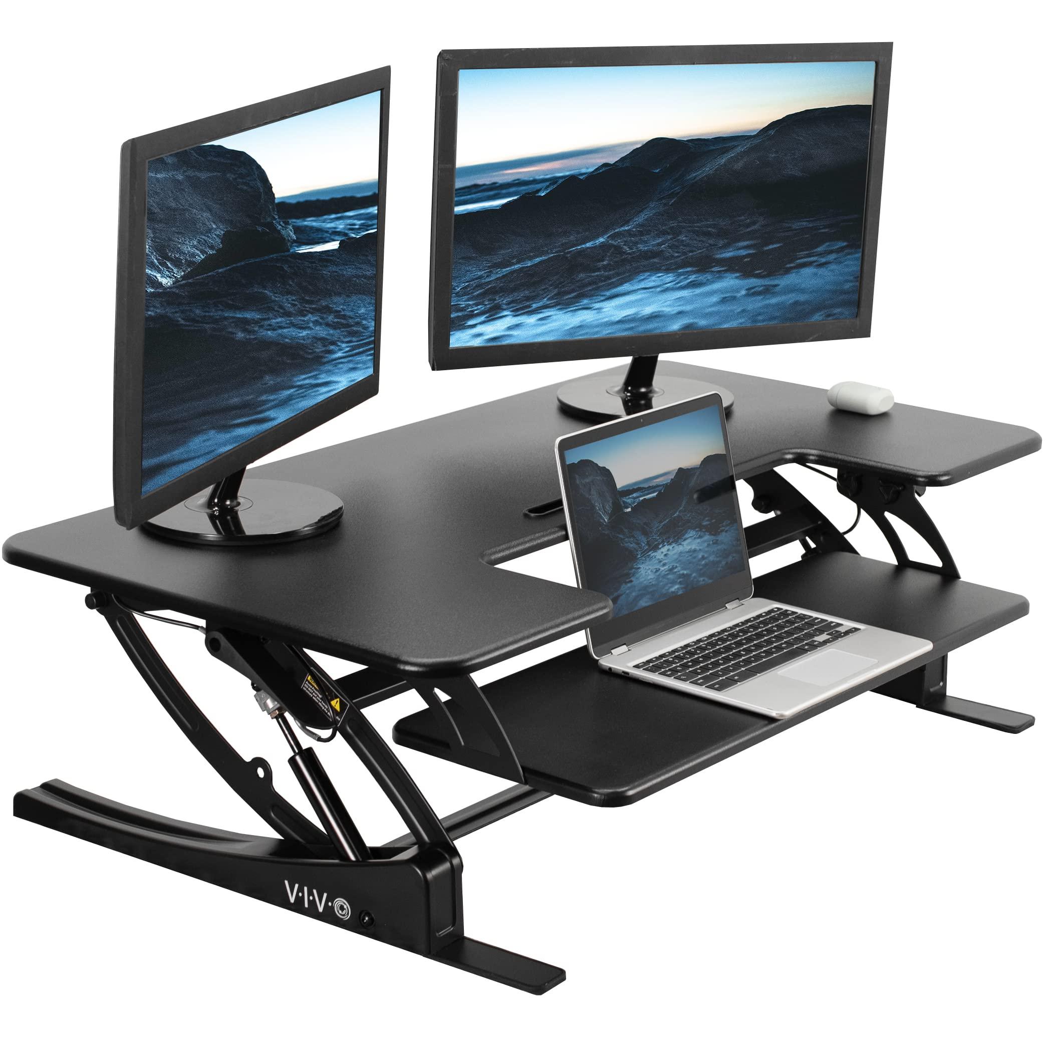 VIVO 42 inch Height Adjustable Stand Up Desk Converter with dual monitors on top of an existing desk