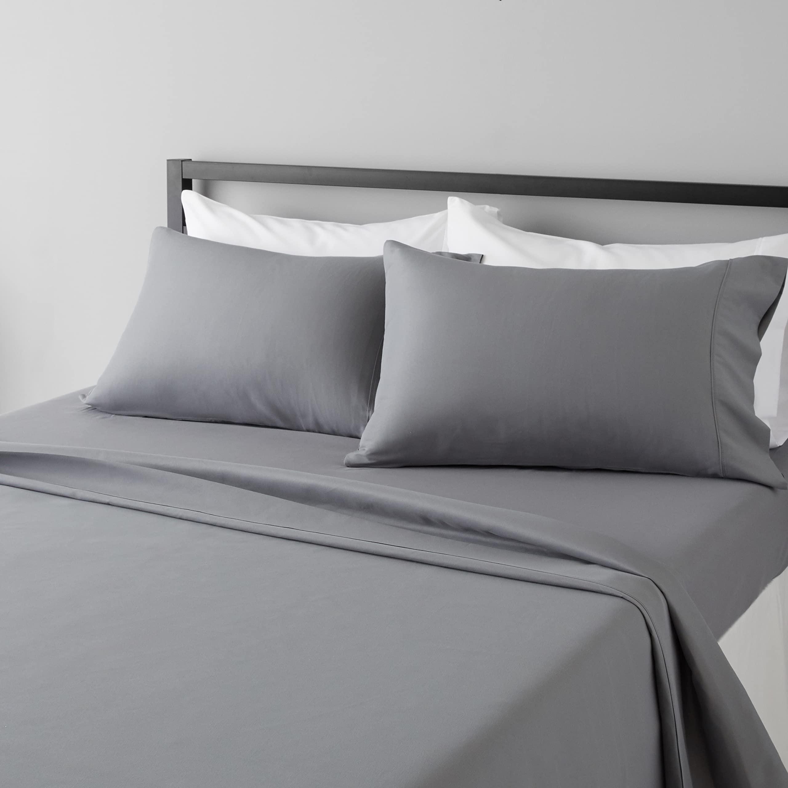 Amazon Basics microfiber sheet set in dark gray on a bed