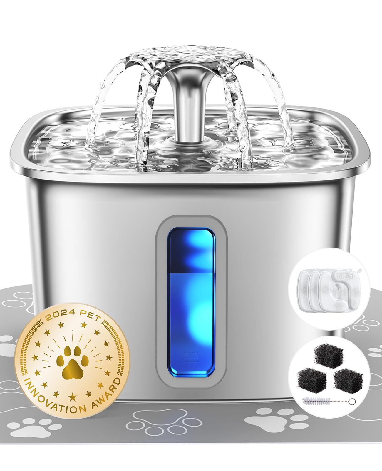 Veken Stainless Steel Cat Water Fountain with replacement filters and silicone mat on a kitchen counter