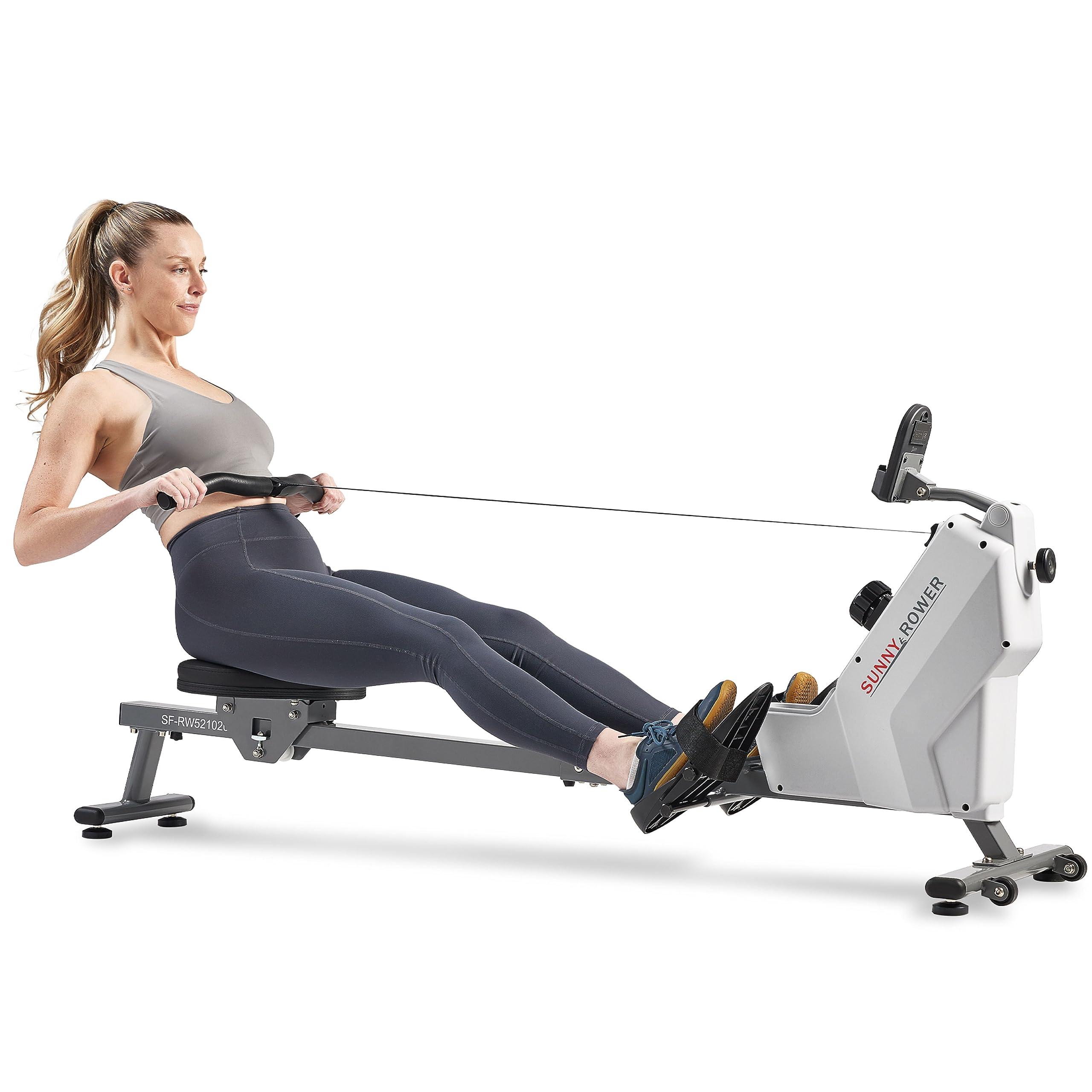Sunny Health & Fitness Magnetic Rowing Machine on a home gym floor