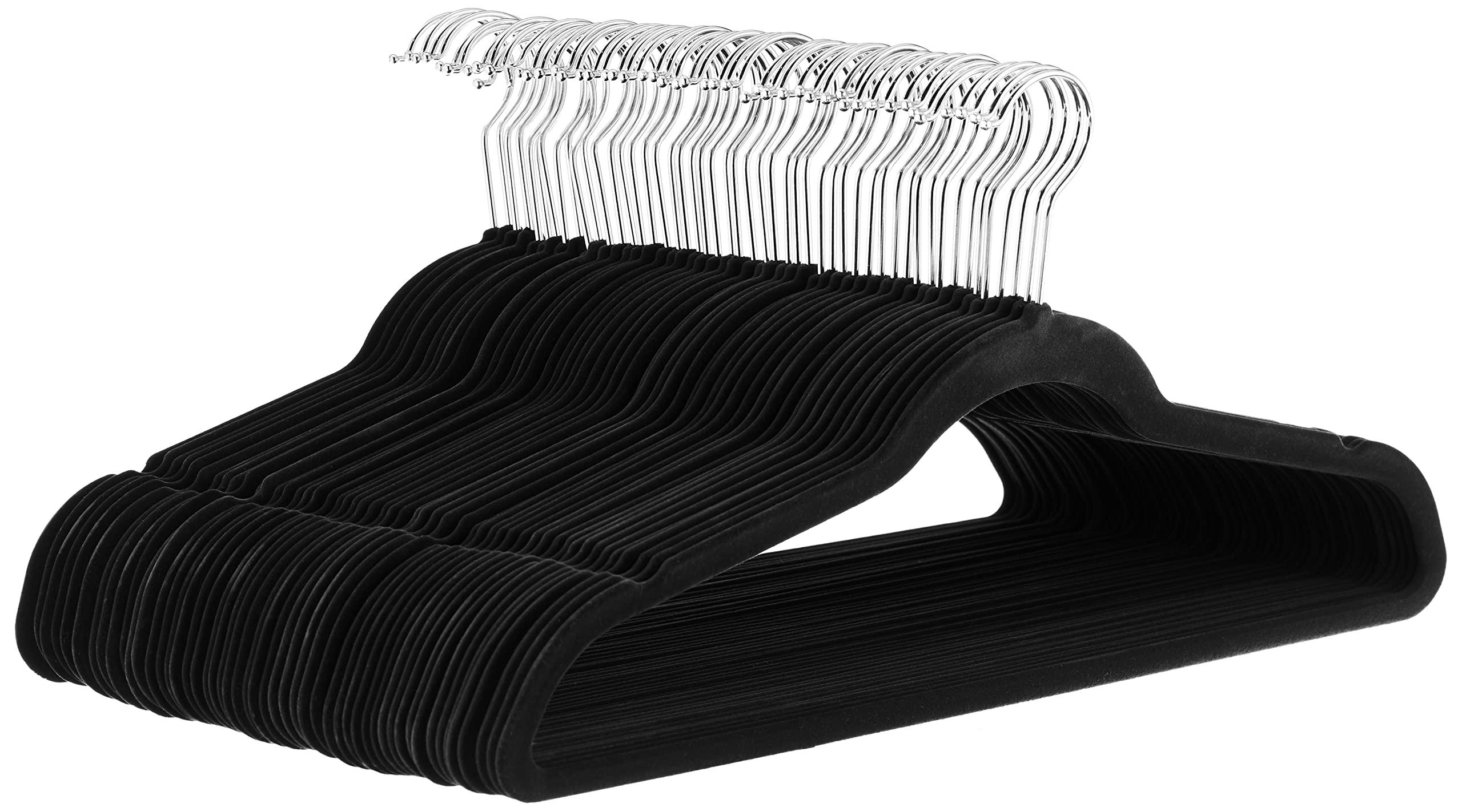 Amazon Basics Slim Velvet Hangers in black, holding clothes
