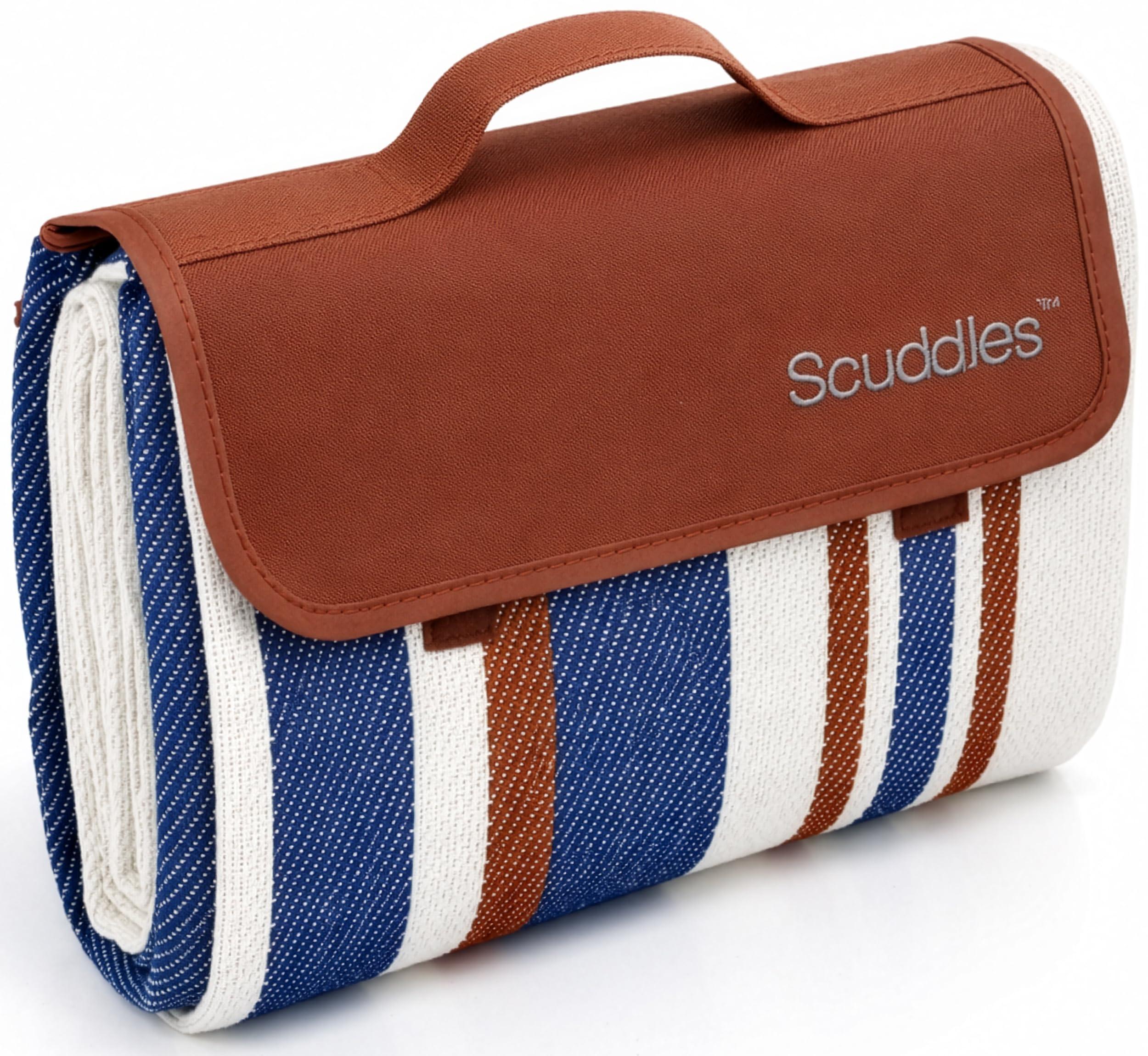 scuddles Extra Large Picnic Blanket spread on grass, striped blue and white pattern