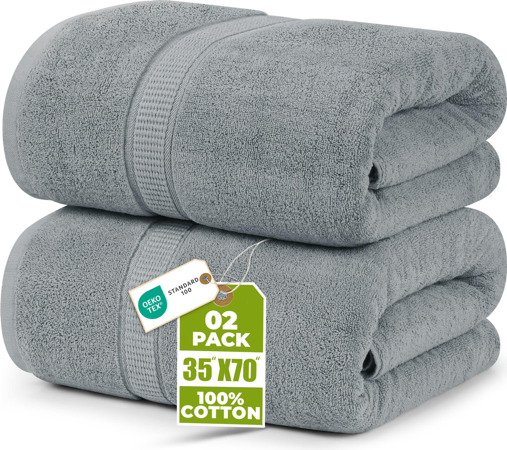 Utopia Jumbo Bath Sheet in Cool Grey draped over a towel bar