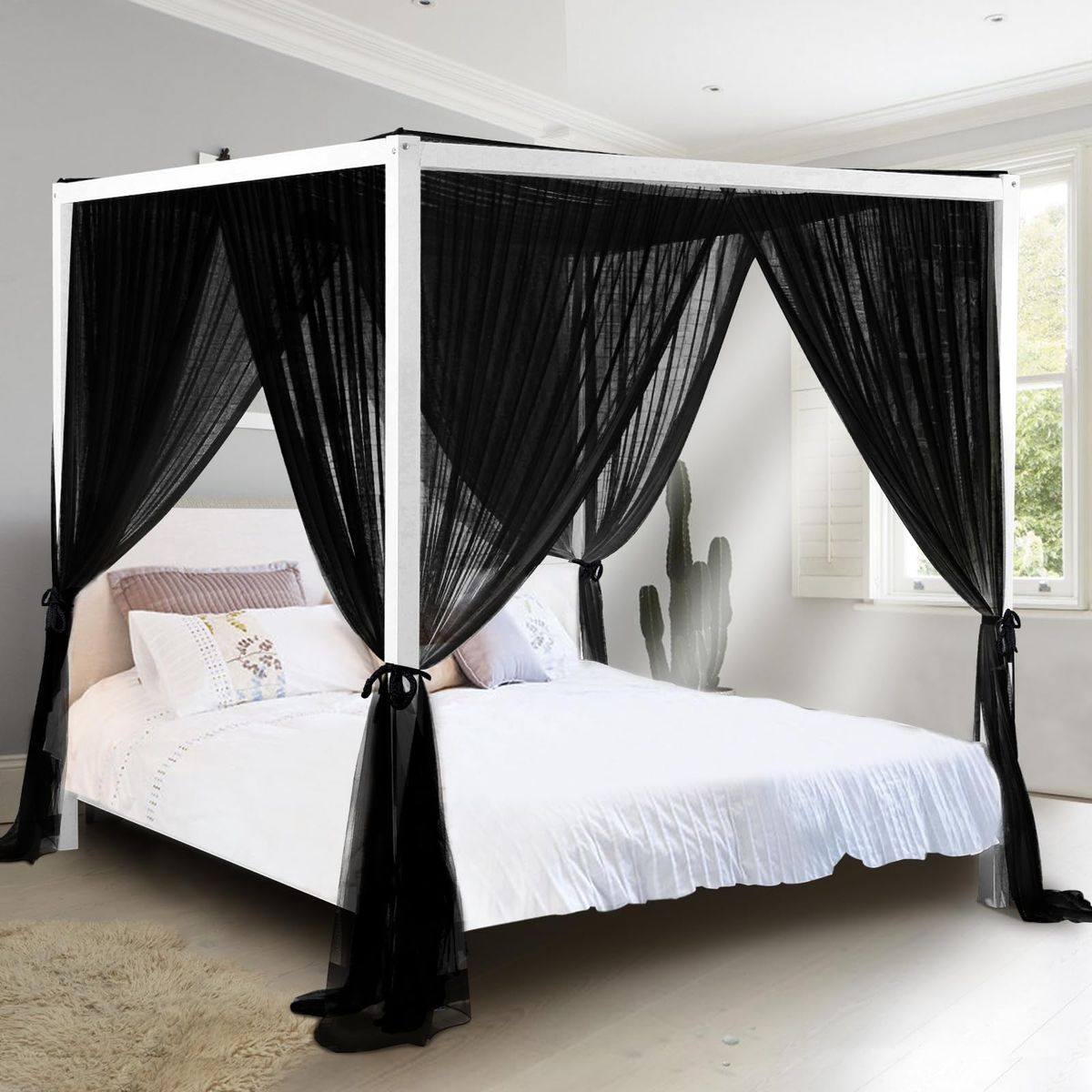 South to East Black Canopy Bed Curtains draped over a bed