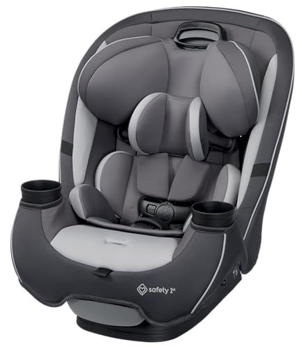 A baby in a rear-facing infant car seat installed securely in the backseat of an American family SUV, 5-point harness snug at chest level, side-impact protection wings visible, LATCH anchors attached — the correct installation setup that child safety technicians verify at free NHTSA car seat check events across the United States.