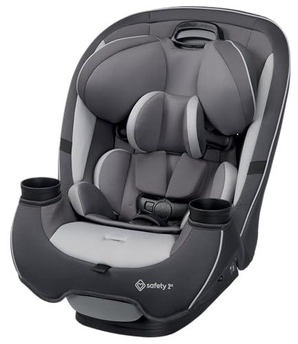 A baby in a rear-facing infant car seat installed securely in the backseat of an American family SUV, 5-point harness snug at chest level, side-impact protection wings visible, LATCH anchors attached — the correct installation setup that child safety technicians verify at free NHTSA car seat check events across the United States.