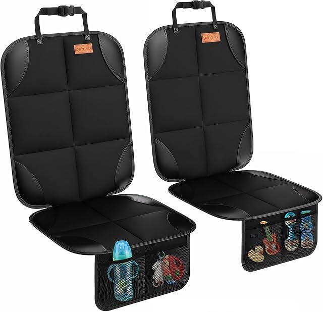 Car interior with seat protectors installed on rear seats, protecting against child car seat indentations and spills