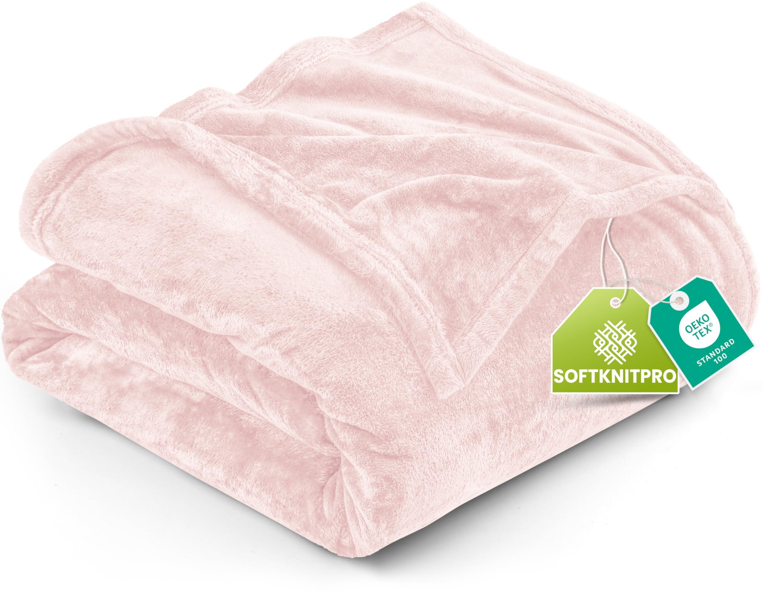 Utopia Bedding Fleece Blanket in pink on a bed
