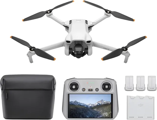 DJI Mini 3 Fly More Combo unfolded with the DJI RC controller showing its 5.5-inch built-in screen — the Combo includes 3 batteries and a charging hub