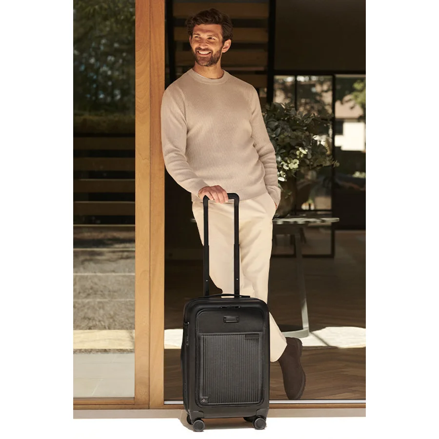 Briggs & Riley Baseline CX expandable carry-on in black ballistic nylon with leather accents and CX expansion-compression system