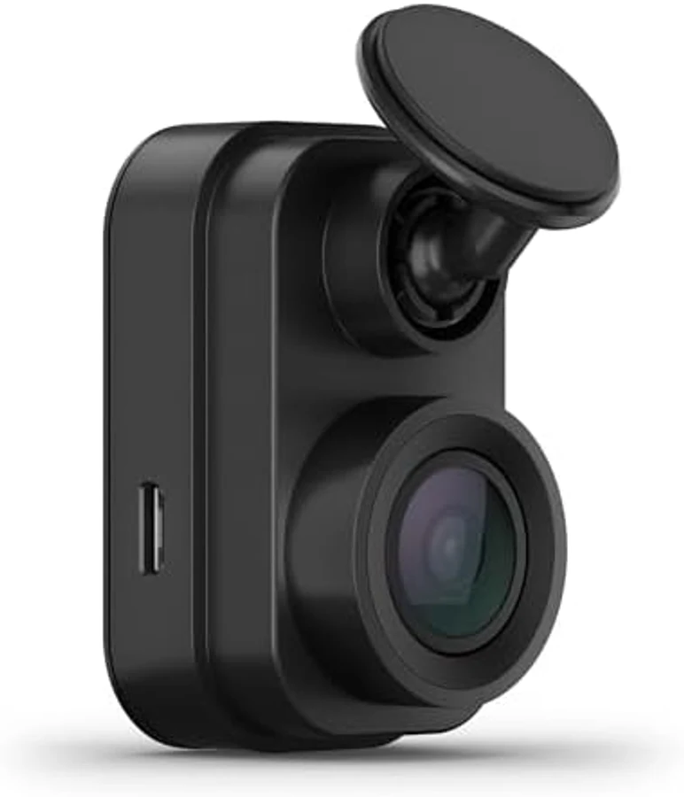 Garmin Dash Cam Mini 2 in compact black cubic form factor with single camera lens featuring a purple-blue lens coating typical of wide-angle dash cam optics — the smallest dash cam in the 2026 US market with 4,755 owner ratings the deepest review history in the entire dash cam category
