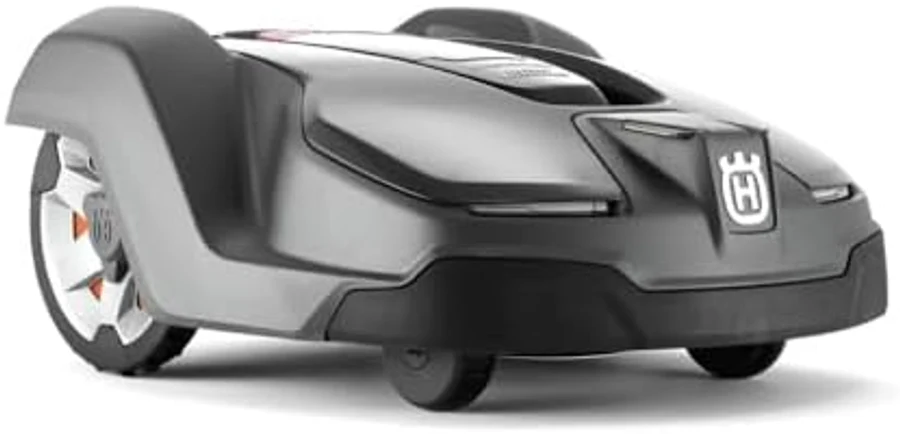 Husqvarna Automower 430X robot lawn mower in dark gray and bright orange, low-profile aerodynamic chassis with refined Scandinavian industrial design