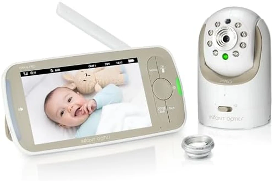 Infant Optics DXR-8 PRO Video Baby Monitor system showing the dedicated 5-inch parent screen with a baby visible in the display and the matching white tabletop camera unit, both clearly branded Infant Optics — the 2026 deepest-reviewed no-Wi-Fi baby monitor on Amazon at 7,002 owner ratings ★4.6
